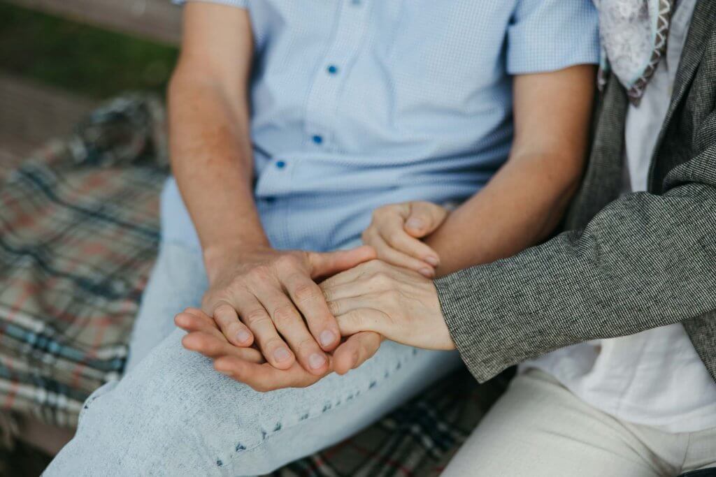 two people holding hands